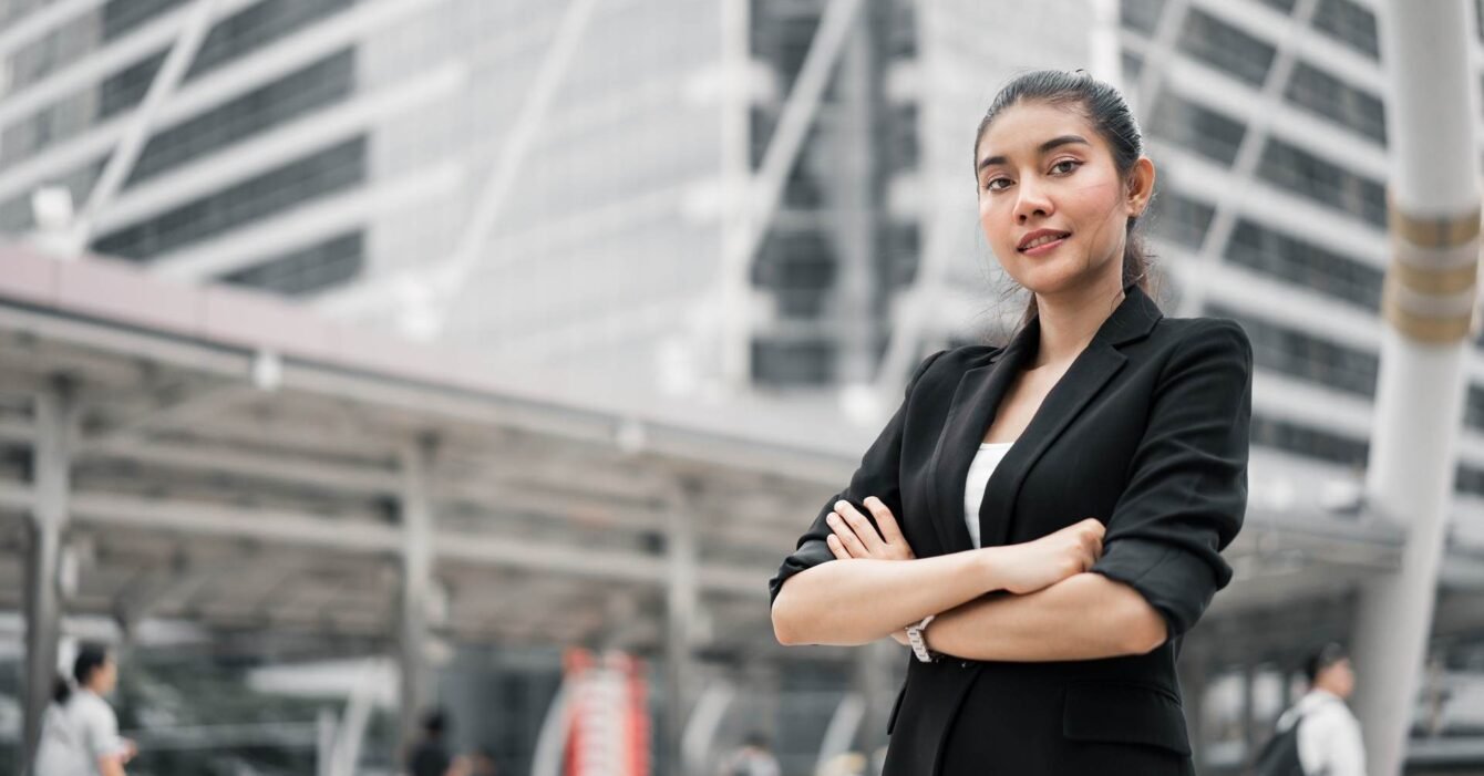 portrait-young-businesswoman-with-arms-crossed-standing-footpath portrait-young-businesswoman-with-arms-crossed-standing-footpath